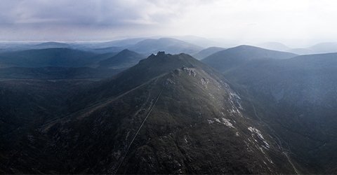 A view of mountains with foot paths