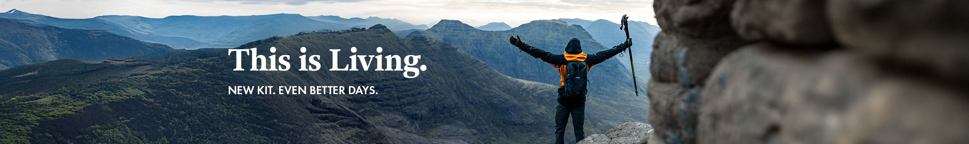 This is living. New Season. Man on mountain looking at the view